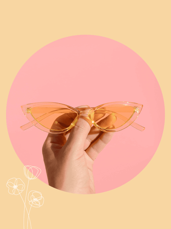 a pair of orange cat eye glasses 