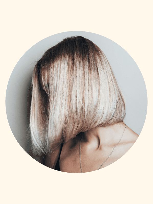 blonde woman with a chin length bob hair style