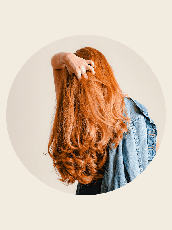 woman with red long layered hair